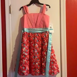 Never worn Girls size 16 dress with tag still on!